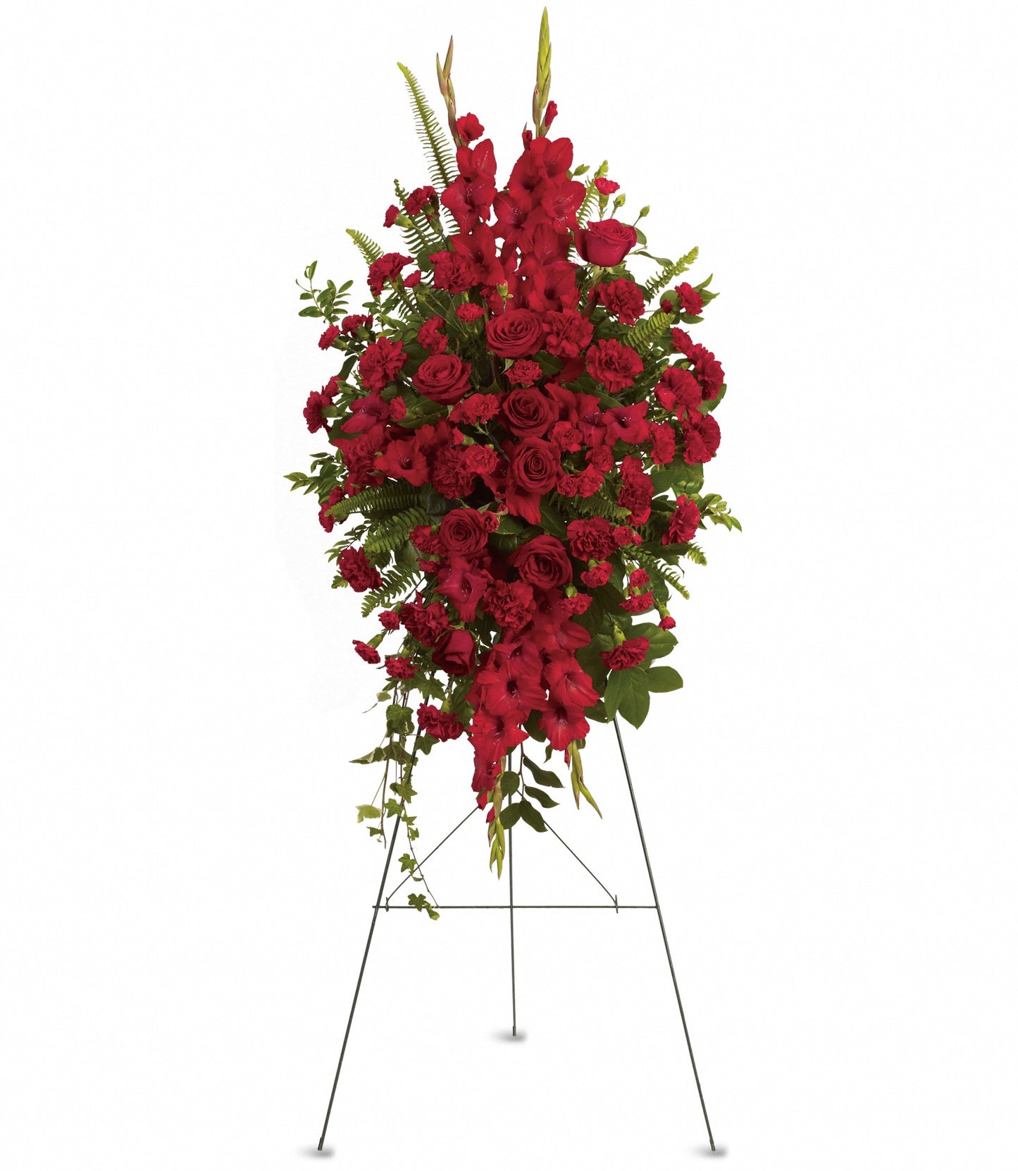 The Deep in Our Hearts Spray is a standing funeral arrangement of red roses, red carnations, and gladiolus with greenery, displayed on a metal easel against a white background.