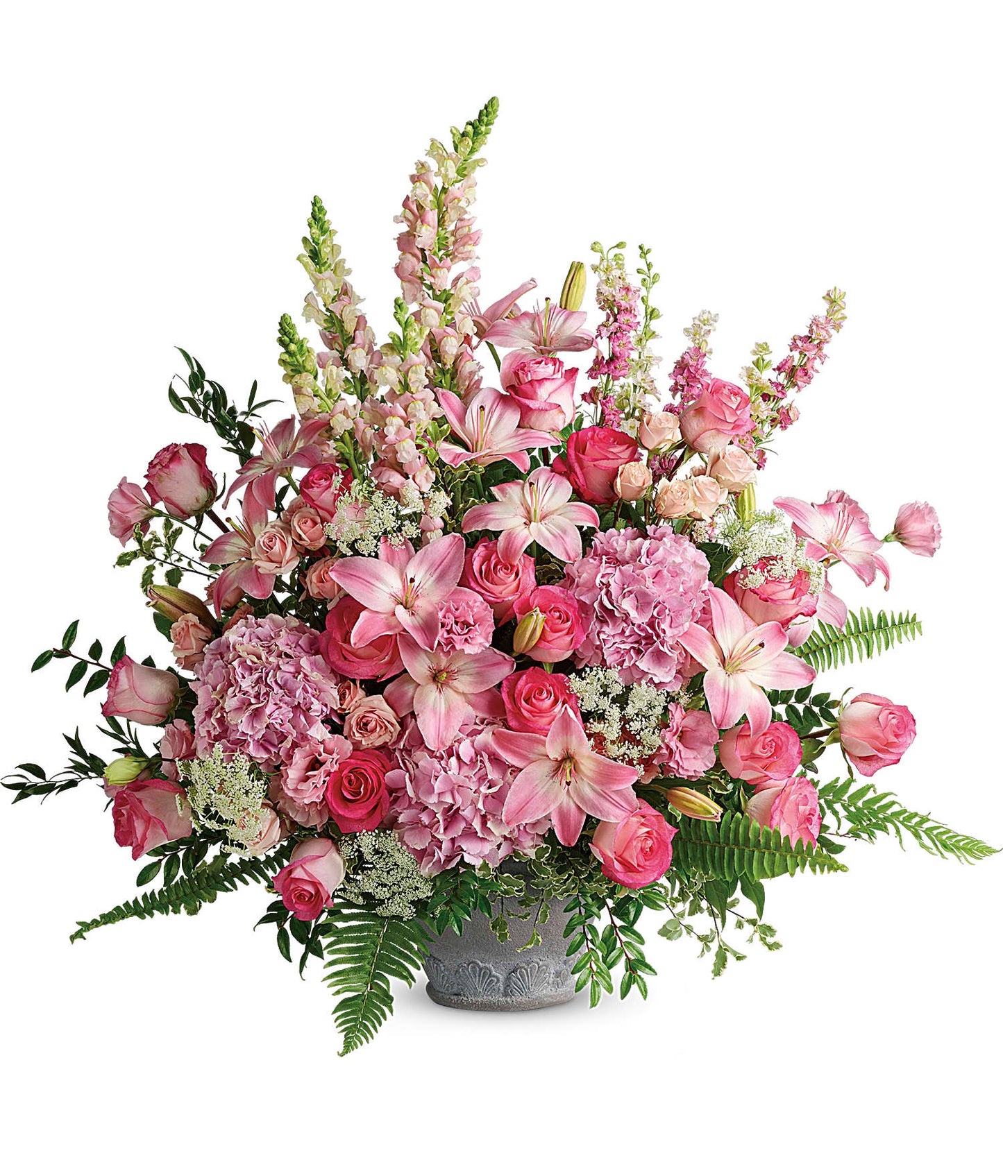 The Graceful Glory Bouquet is a large pink flower arrangement in a gray Parisian Garden Pot, featuring lilies, roses, and snapdragons with lush greenery and ferns in various shades of pink and white.