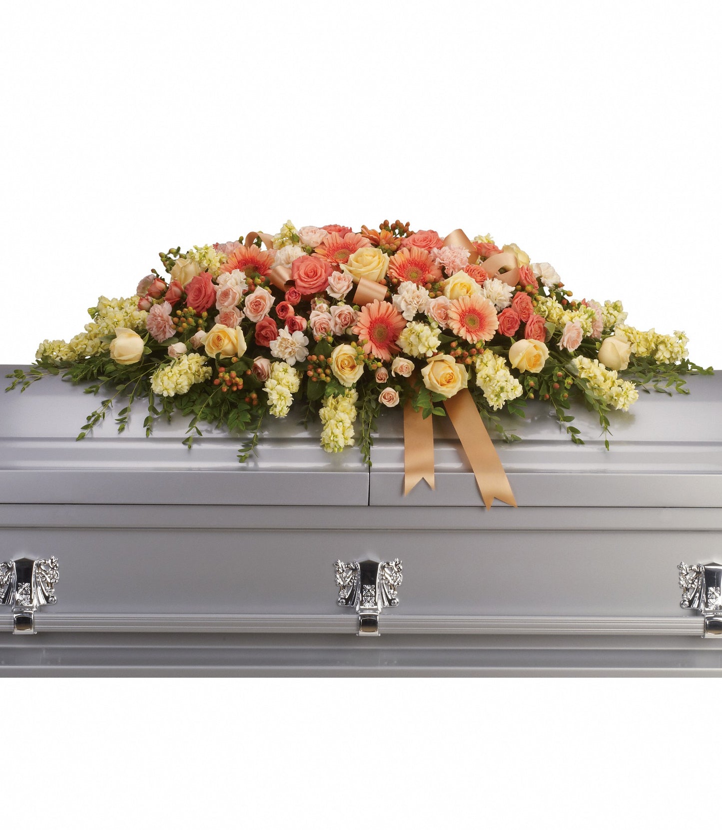 The Warmest Remembrance Casket Spray features a silver casket adorned with peach roses, light orange gerberas, daisies, lush green foliage, and a gold ribbon.