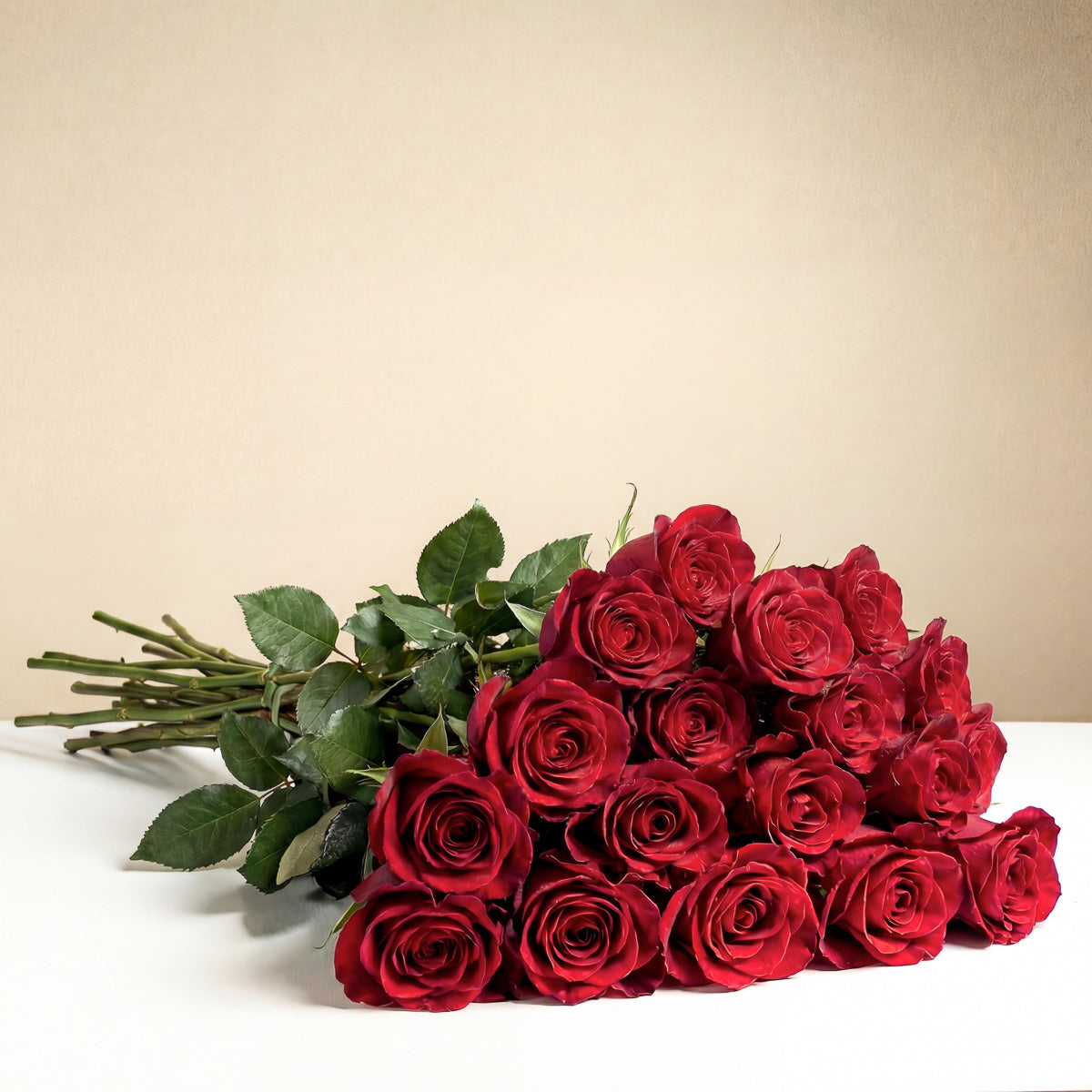 TF’s Long Stem Red Roses Wrapped features twelve fresh red roses with rich green stems and leaves, elegantly arranged in two layers—a romantic, heartfelt gift perfect for any occasion.