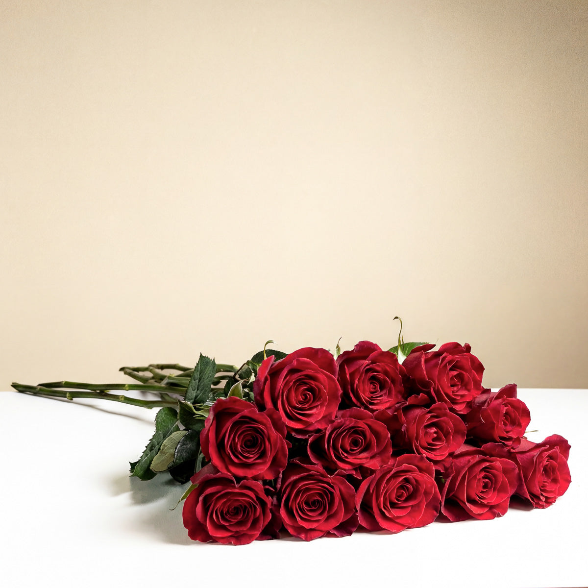 TF’s Long Stem Red Roses Wrapped features twelve fresh red roses with rich green stems and leaves, elegantly arranged in two layers—a romantic, heartfelt gift perfect for any occasion.