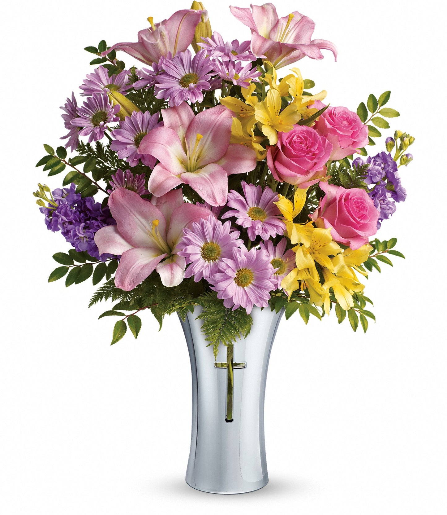 The Bright Life Bouquet features pink asiatic lilies, hot pink roses, yellow alstroemerias, purple daisies, and greenery in a tall Shining Cross vase adorned with a gold cross on the front.