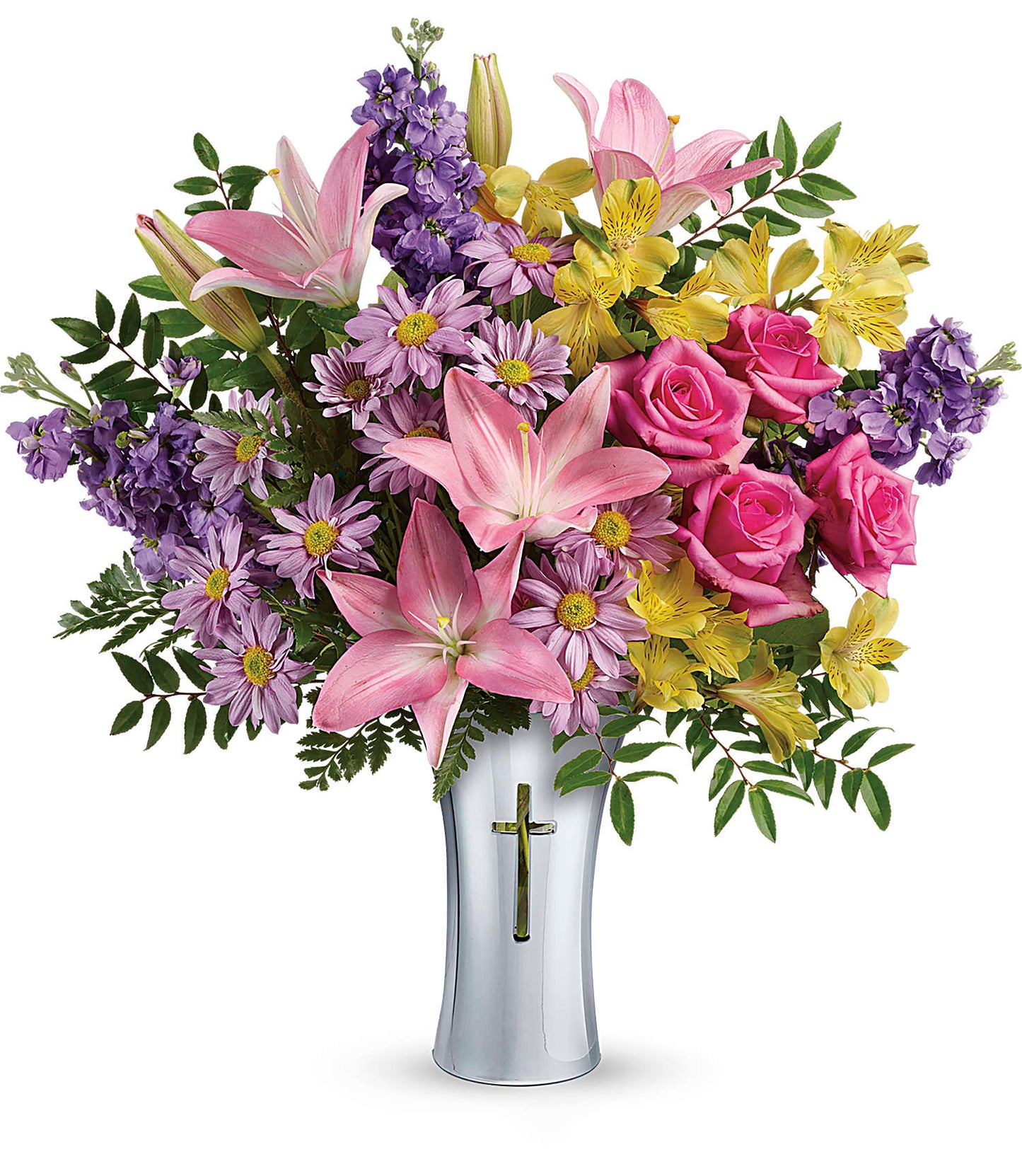 The Bright Life Bouquet features pink asiatic lilies, hot pink roses, yellow alstroemerias, purple daisies, and greenery in a tall Shining Cross vase adorned with a gold cross on the front.