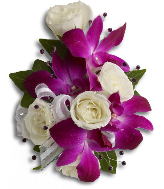 The TF Fancy Orchids and Roses Wristlet showcases vibrant purple dendrobium orchids, white spray roses, green leaves, decorative purple beads, and a white ribbon with silver trim, arranged beautifully against a white background.