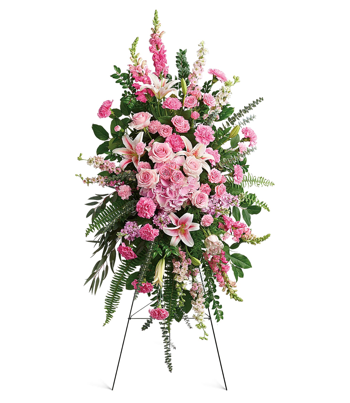 The Glorious Farewell Spray is a pink floral easel arrangement with roses, lilies, carnations, snapdragons, and greenery on a sleek metal stand against a white background.