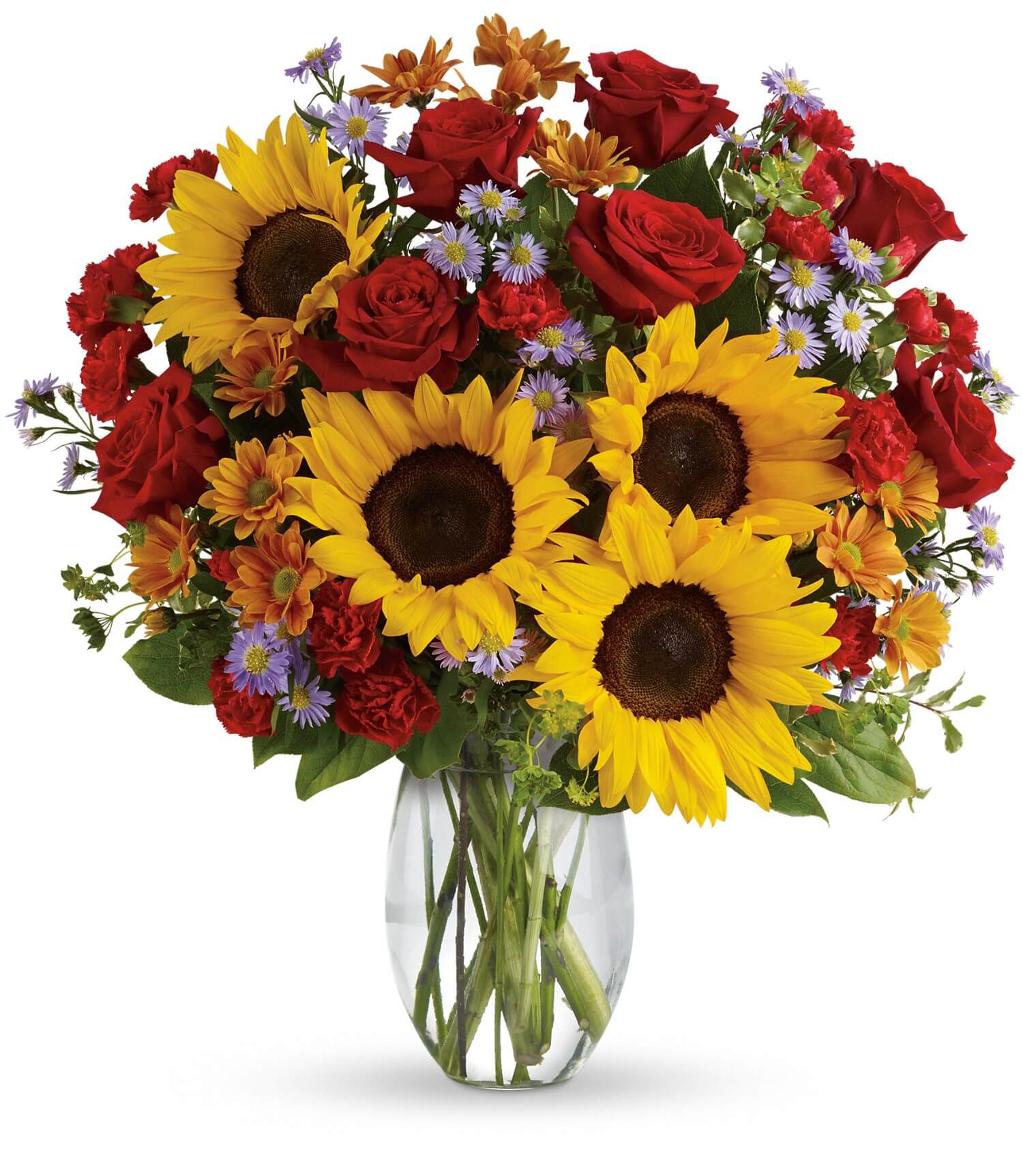 The Pure Happiness Bouquet by TF features sunflowers, red roses, orange daisies, purple fillers, and green leaves in a clear glass vase, creating a vibrant arrangement against a white background.