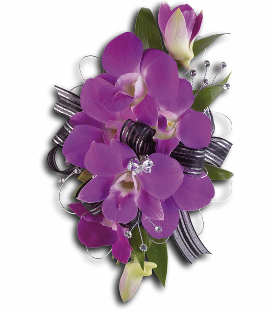 The TF Purple Promise Wristlet showcases vibrant purple dendrobium orchids, Italian ruscus, a black and silver striped ribbon, and silver beads, arranged on a white background.