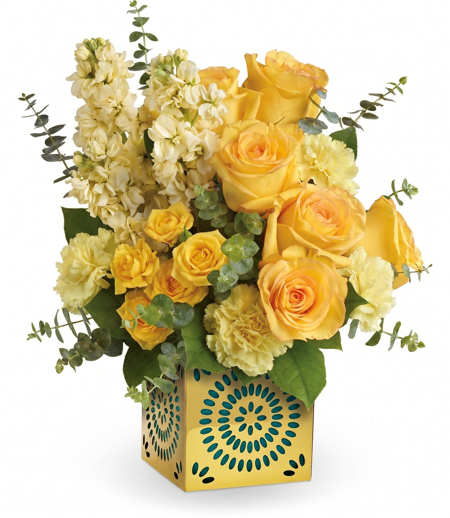 The Shimmer Of Thanks Bouquet features yellow roses, yellow carnations, and stock with eucalyptus in a Celebrate in Style cube—a yellow vase with blue and green geometric patterns.